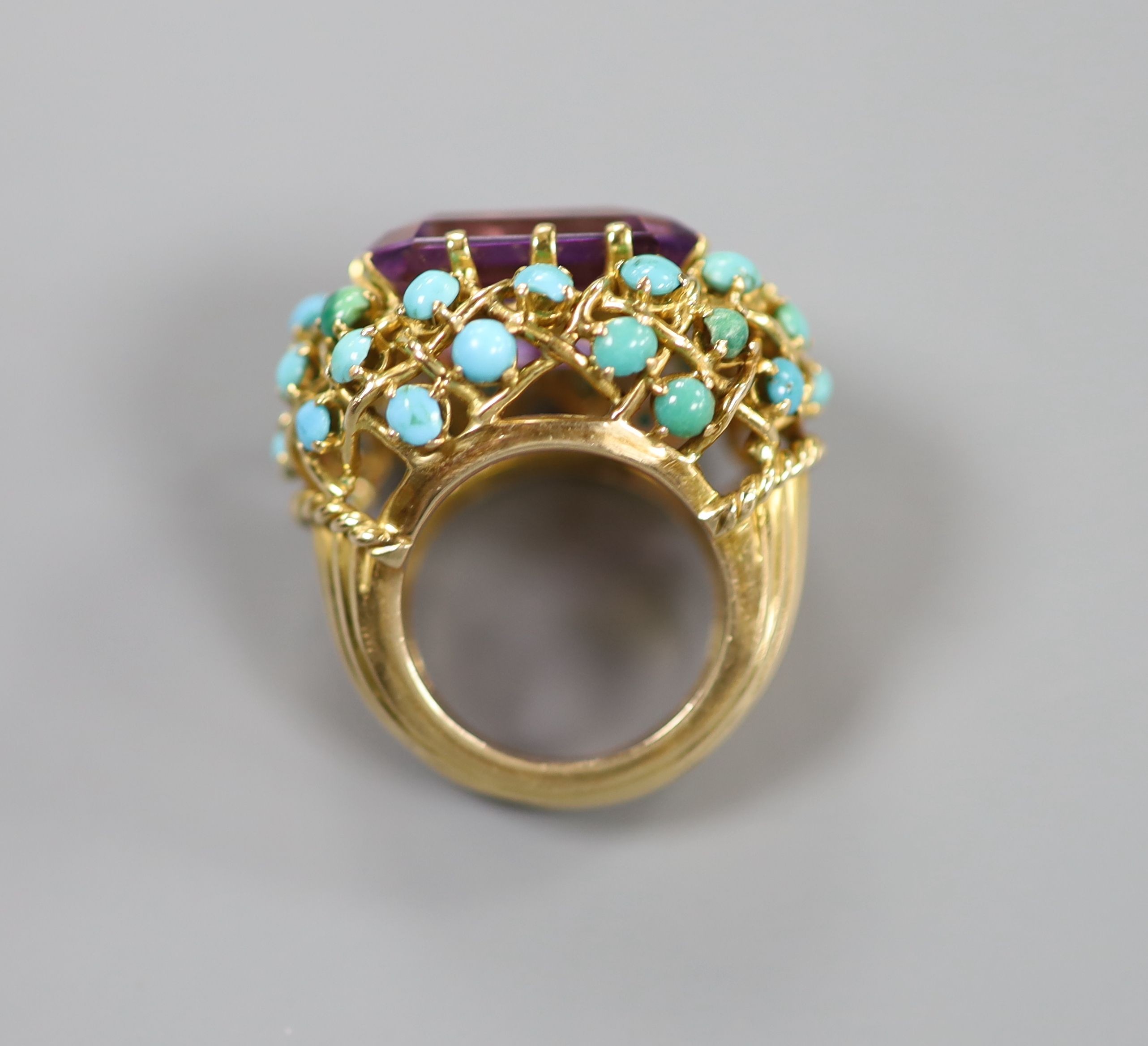 A French yellow metal (18ct poincon mark), amethyst and turquoise set cluster dress ring, with ribbed shank, size J, gross weight 19.2 grams.